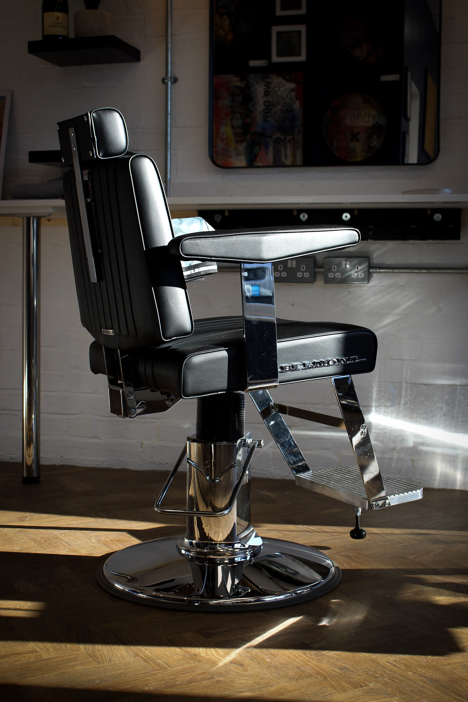 Black and chrome barber chair in the morning sun