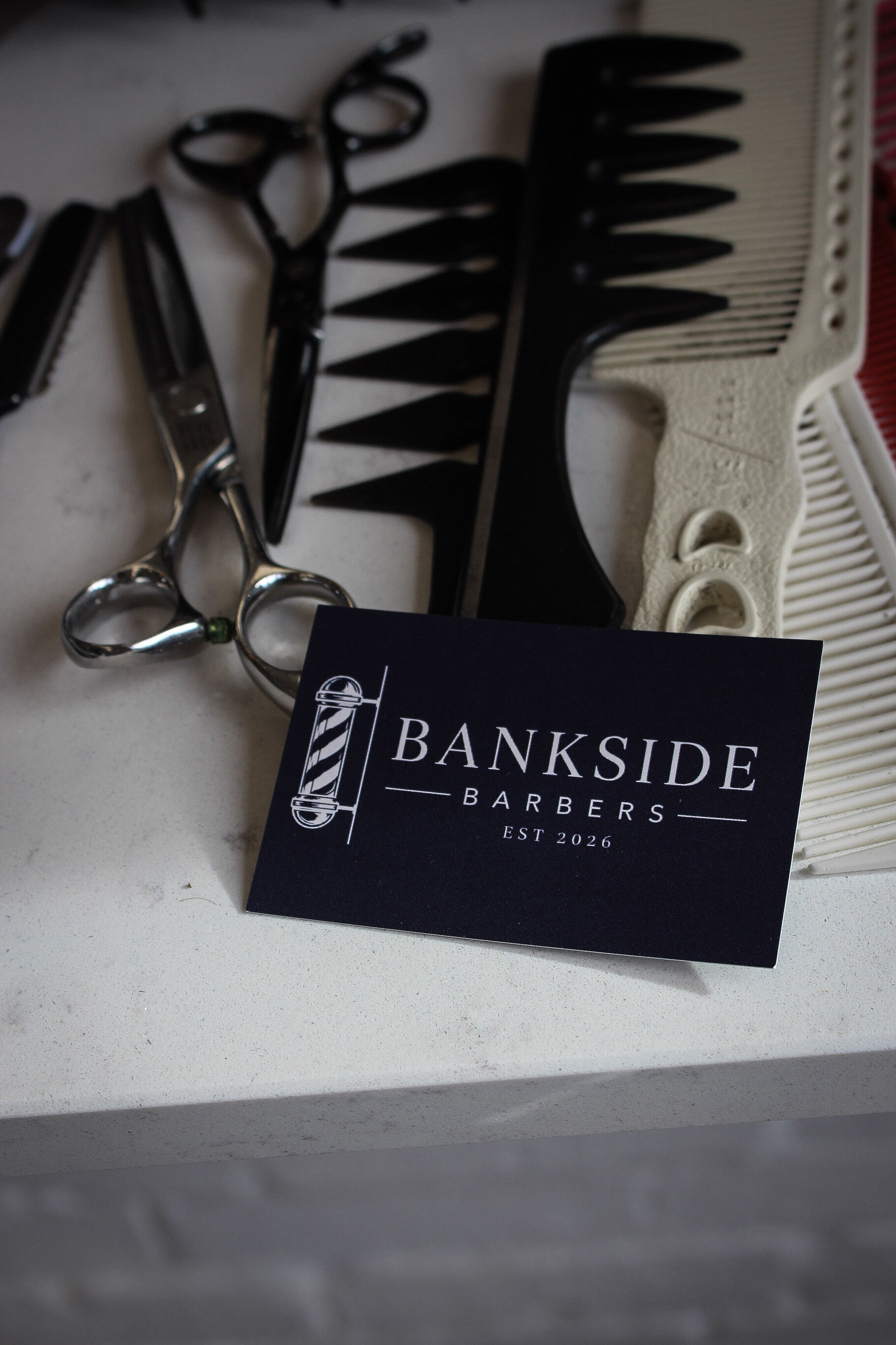 Scissors, combs and a Bankside Barbers card