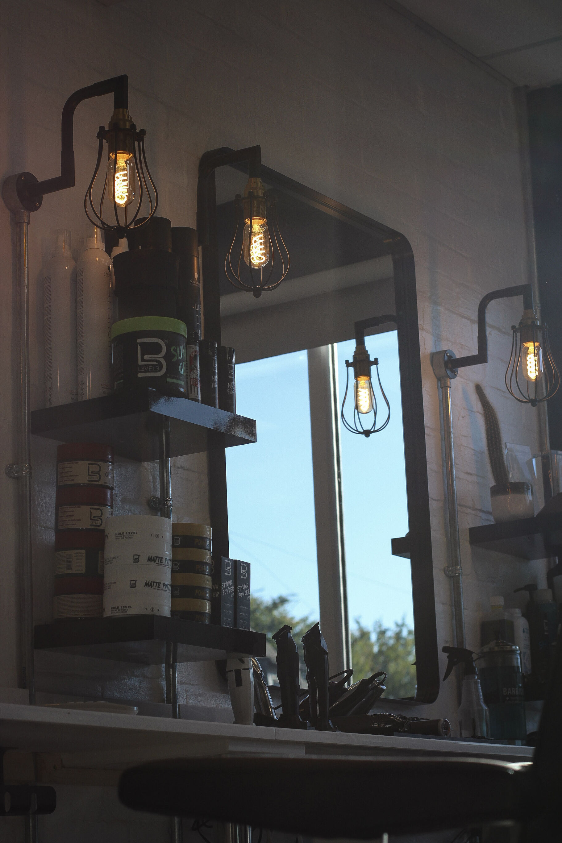 Mirror, shelves and filament lamps at the station